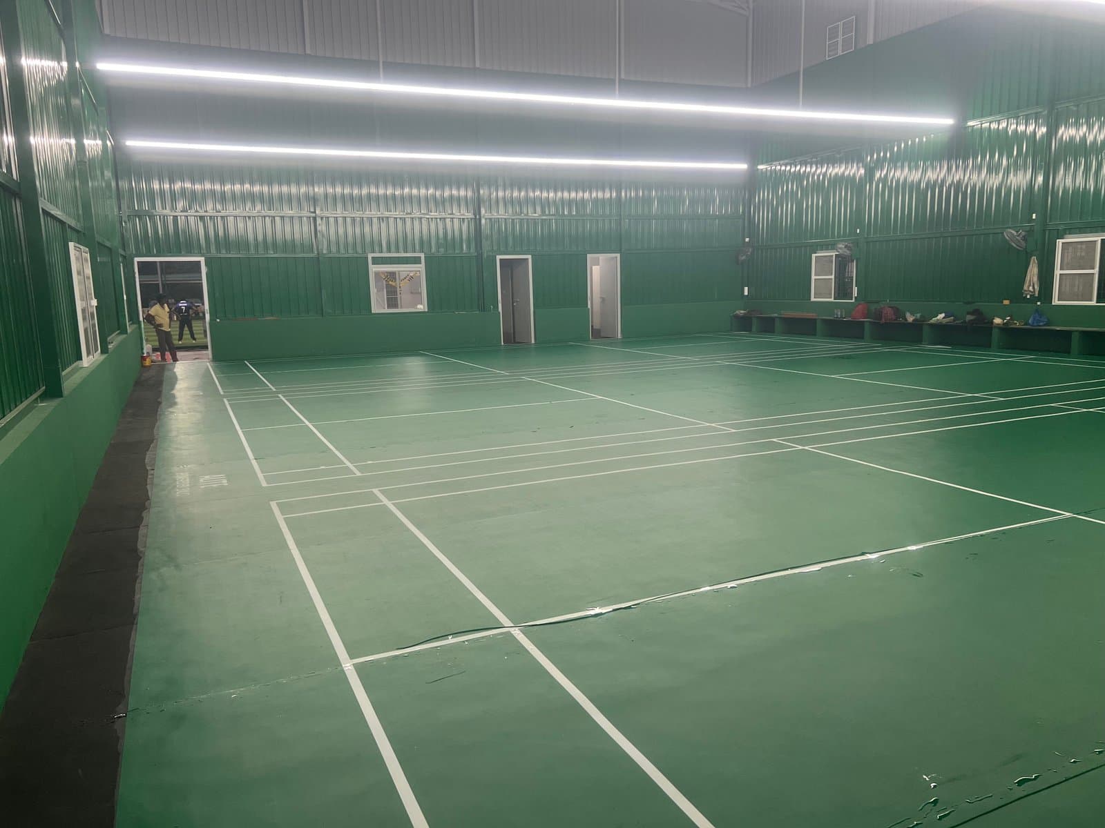 Indoor badminton hall with green sports flooring at 3T Sports Academy, Salem, built by Fitoverse
