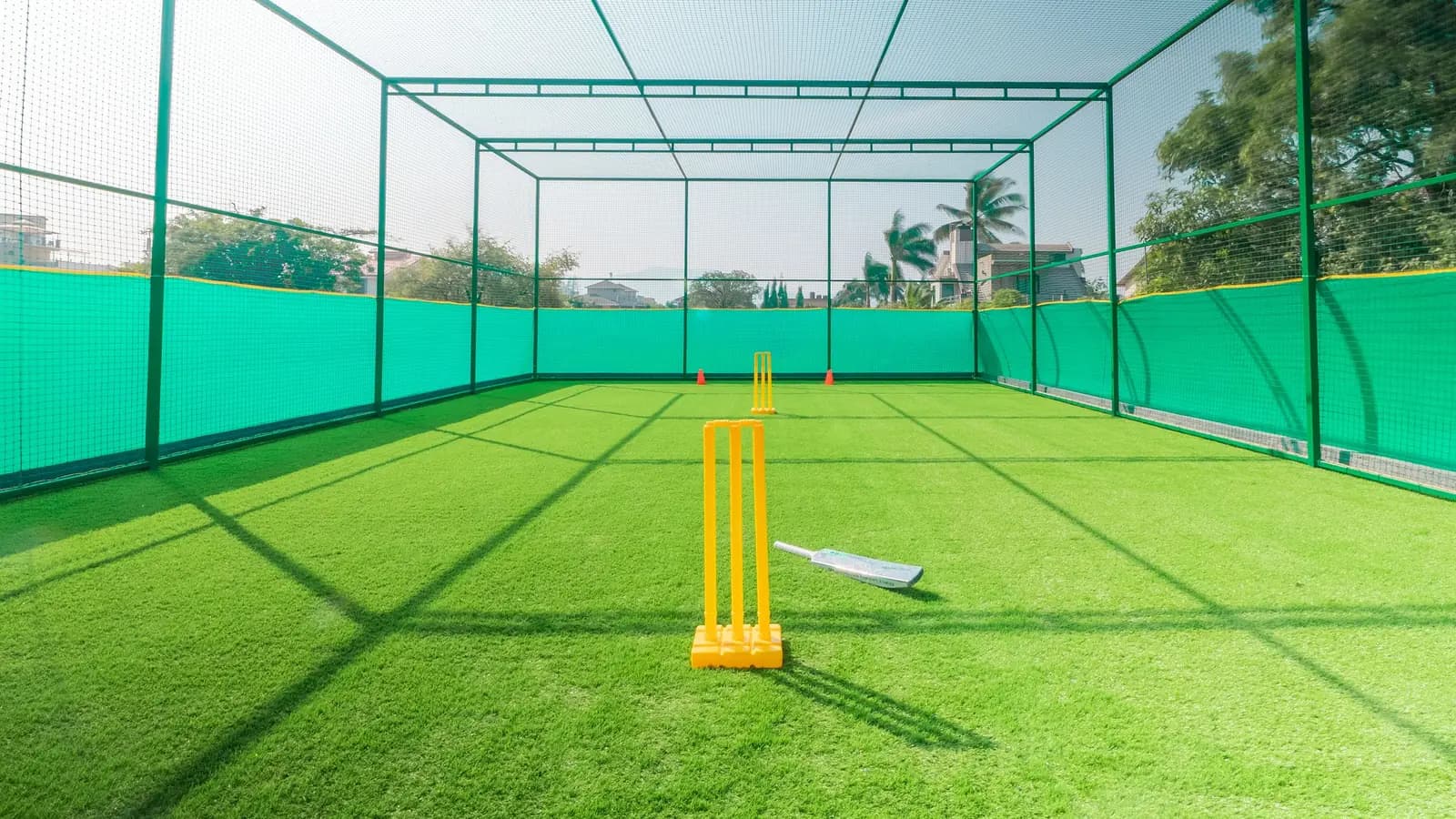 Cricket practice nets with artificial turf and stumps